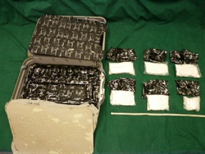 The cocaine was concealed in the false compartment of a suitcase.