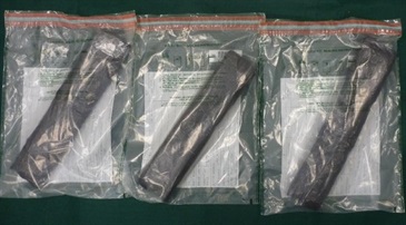 Suspected cocaine found inside the false compartments of the suitcase.