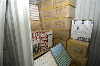 Illicit cigarettes found in a false compartment of the container by Customs.