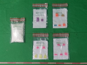Hong Kong Customs seized about 970 grams of suspected ketamine, 88 grams of suspected ecstasy and 1.85 kilograms of suspected cocaine with an estimated market value of about $2.3 million at Hong Kong International Airport on May 15 and yesterday (May 17) respectively. Photo shows the suspected ketamine and suspected ecstasy seized.