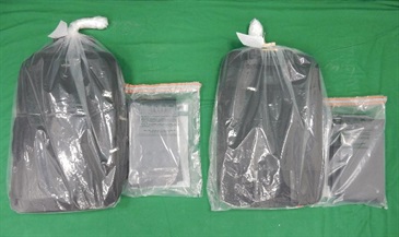 Hong Kong Customs yesterday (November 30) seized about 9.3 kilograms of suspected cocaine with an estimated market value of about $11 million at Hong Kong International Airport. The suspected cocaine was found concealed inside the periphery of two pieces of luggage.