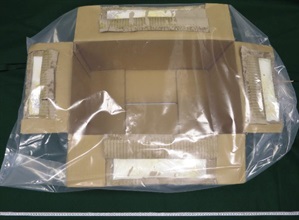 Hong Kong Customs seized about 180 kilograms of suspected methamphetamine and about 14kg of suspected heroin with a total estimated market value of about $140 million at Hong Kong International Airport, at Lok Ma Chau Control Point and in Tsuen Wan on October 5 and yesterday (October 7). Photo shows a carton box used to conceal suspected heroin.