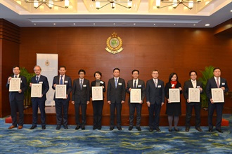 The Assistant Commissioner of Customs and Excise (Excise and Strategic Support), Mr Jimmy Tam (centre), is pictured with representatives of the eight new Hong Kong Authorized Economic Operators at the Hong Kong Authorized Economic Operator certificate presentation ceremony today (January 13).