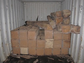 Wooden crates located at the rear of the container.