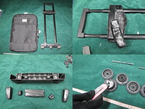 Cocaine concealed in the metal handles and plastic wheels of the arrestee's suitcase.