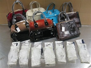 On August 21, Hong Kong Customs seized 1 kg of methamphetamine (Ice), valued at about $750,000, concealed in the inner layer of some handbags from an air parcel exported from Hong Kong to Philippines.