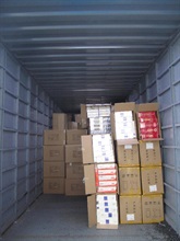 Illicit cigarettes seized in a cross-boundary vehicle.