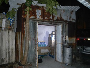 Photo shows the hut used by the smuggling syndicate to store powdered formula.
