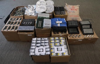 Hong Kong Customs seized a large haul of suspected smuggled goods including electronic goods and plastic beads with an estimated market value of about $21 million at Lok Ma Chau Control Point on September 19.