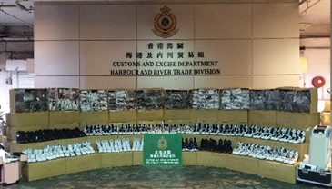 Hong Kong Customs seized about 9 000 pairs of suspected counterfeit sports shoes and 450 suspected smuggled beauty products with an estimated market value of about $560,000 from a container at the Customs Cargo Examination Compound, River Trade Terminal, Tuen Mun on June 8.