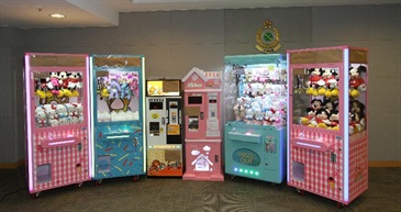 Hong Kong Customs conducted a territory-wide operation codenamed "Octopus" from June 5 to yesterday (June 13) to combat claw-machine shops offering counterfeit dolls. A total of about 2 700 suspected counterfeit dolls and other relevant items with an estimated market value of about $300,000 were seized. Photo shows some of the claw machines and token changing machines seized.