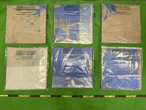 Hong Kong Customs yesterday (September 24) arrested three men, aged between 26 and 28, suspected to be connected with four drug trafficking cases through the air cargo channel of which a total of about 8.8 kilograms of suspected methamphetamine and about 3.7kg of suspected ketamine with an estimated market value of about $8 million were seized at Tsing Yi and Hong Kong International Airport. Photo shows the false compartments of the carton boxes used to conceal the suspected ketamine.