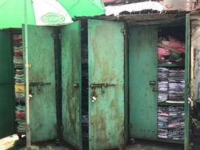 Hong Kong Customs conducted an operation against the sale of counterfeit items at a mobile hawker stall on July 27. About 6 900 items of suspected counterfeit goods, including clothing, caps and shoes, with an estimated market value of about $420,000 were seized. Photo shows some of the mobile storage facilities.