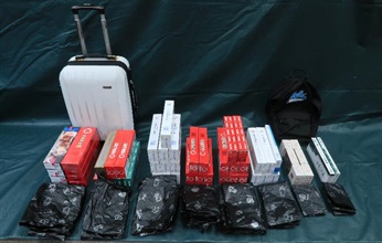 Hong Kong Customs yesterday (August 12) mounted an operation against illicit cigarette activities in Kwai Chung and Fanling and seized about 200 000 suspected illicit cigarettes with an estimated market value of about $600,000 and a duty potential of about $400,000. Photo shows the suspected illicit cigarettes seized at a public housing flat in Fanling.