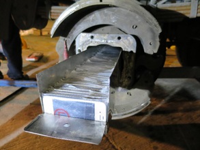 The smartphones were placed in the U-shaped metal beams concealed in an altered axle of a trailer.
