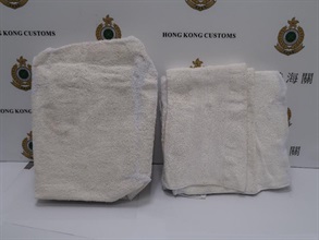 Hong Kong Customs mounted a special operation codenamed "Guardian" to combat cross-boundary drug trafficking activities around the past summer holiday from July 1 to September 8. A total of 163 dangerous drug cases were detected and about 334.4 kilograms of different kinds of suspected dangerous drugs with an estimated market value of about $126 million were seized. Photo shows some of the seized towels soaked with suspected liquefied cocaine.