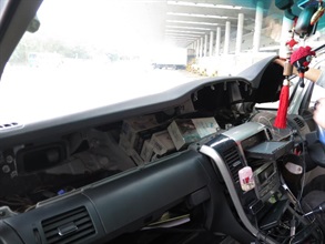 Suspected illicit cigarettes concealed inside a compartment of the front panel.