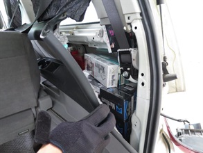 Suspected illicit cigarettes concealed inside a compartment near the rear light.