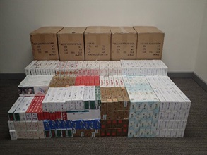 Hong Kong Customs mounted a territory-wide operation codenamed "Hammer" to strike storage and distribution activities of illicit cigarettes from December 5 to today (December 7). A total of about 680 000 suspected illicit cigarettes with an estimated market value of about $1.8 million and a duty potential of about $1.3 million were seized. Photo shows the suspected illicit cigarettes seized in Mong Kok.