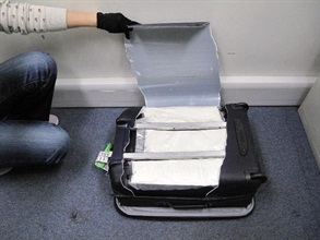 The cocaine was found inside a hidden compartment of the suspect's suitcase.