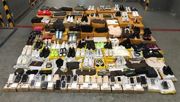 Hong Kong Customs conducted a two-week joint operation with the Mainland and Macao Customs from October 14 to 27 to combat cross-boundary counterfeit goods activities among the three places and with goods destined for overseas countries. During the operation, Hong Kong Customs seized about 37 000 items of suspected counterfeit goods with an estimated market value of about $4.9 million. Photo shows some of the suspected counterfeit goods seized.
