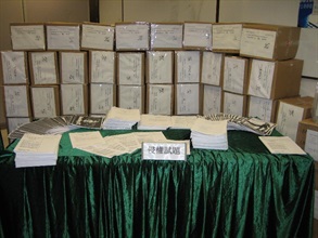 Some of the suspected infringing photocopies of past examination papers seized.