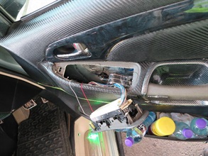 Sixty used phone monitors were concealed inside the space underneath the handles of both front doors of the seven-seater private car in the suspected smuggling case.