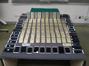 The brand new smartphones and used phone monitors seized by the Customs.