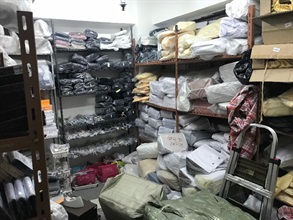 Hong Kong Customs conducted a special operation and smashed a suspected counterfeit syndicate in Mong Kok yesterday (December 13). A seizure of about 3 000 pieces of suspected counterfeit products with an estimated market value of about $4 million was made. Photo shows one of the storages of suspected counterfeit goods.