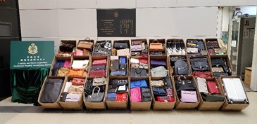 Hong Kong Customs yesterday (December 4) conducted a special operation against the sale of counterfeit goods in upstairs showrooms. About 1 700 items of suspected counterfeit goods, including handbags, belts, watches and shoes, with an estimated market value of about $2 million were seized.