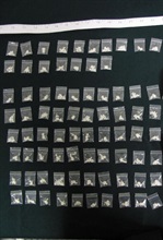 Hong Kong Customs and Excise Department (C&ED) conducted an operation codenamed "Season" during the Christmas and New Year holidays at the airport, seaport, land boundary and railway control points in a bid to combat smuggling and other illegal activities through passenger and cargo channels. Photo shows about 30 grams of crack cocaine with an estimated market value of about $40,000 seized at HK-Macau Ferry Terminal on December 24.
