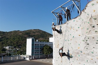 The Customs and Excise Department will start a Probationary Inspector recruitment exercise this Friday (January 26). The application period for the post closes on February 5. Candidates who pass the selection process will receive training at the Customs and Excise Training School. Photo shows trainees undergoing abseiling training.