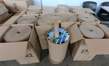 Hong Kong Customs today (February 1) seized about 670 000 suspected illicit cigarettes with an estimated market value of about $1.8 million and a duty potential of about $1.3 million from an incoming container truck at Man Kam To Control Point. Photo shows suspected illicit cigarettes concealed inside carton rolls.