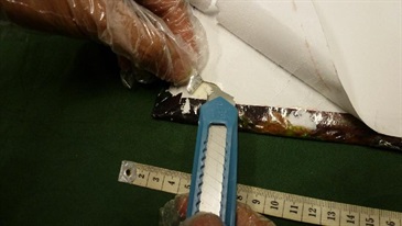 The suspected cocaine was concealed in the front and back of the hard book covers.