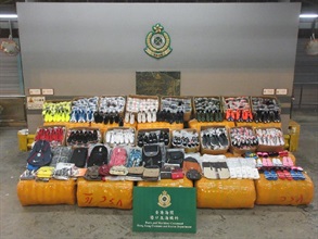 Hong Kong Customs stepped up enforcement to combat cross-boundary smuggling activities before and during the Lunar New Year holiday. Photo shows suspected infringing apparel and accessories seized.