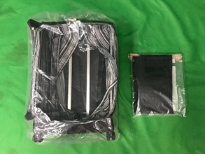 Hong Kong Customs seized about 2.5 kilograms of suspected cocaine with an estimated market value of about $2.6 million from the false compartment of a suitcase at Hong Kong International Airport yesterday (March 15).