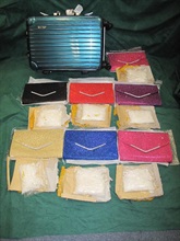 The methamphetamine was concealed in false compartments of seven handbags.