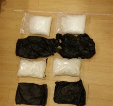 Four packets of suspected methamphetamine seized in the operation.