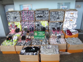 Anticipating that the 2018 FIFA World Cup matches would provide opportunities for criminals to develop infringement business, Hong Kong Customs is undertaking a special operation codenamed "Goalkeeper", focusing on infringing items that may be trafficked through passenger and cargo channels at the airport, seaport, land boundary and railway control points on the eve of the matches. The operation started on April 30, and until yesterday (June 13) about 259 000 suspected infringing items valued at about $15.3 million had been seized in 21 cases with five arrests also made. Photo shows some of the items seized.