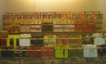 Hong Kong Customs yesterday (October 4) seized about 300 000 suspected illicit cigarettes with an estimated market value of about $800,000 and a duty potential of about $600,000 together with 2 705 cartons of unmanifested assorted goods with an estimated market value of about $300,000 at the River Trade Terminal Cargo Examination Compound in Tuen Mun.