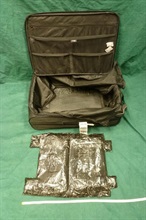 The heroin was concealed in a false compartment of the suitcase.