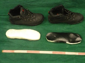 The suspected cocaine concealed under the insoles of the shoes.