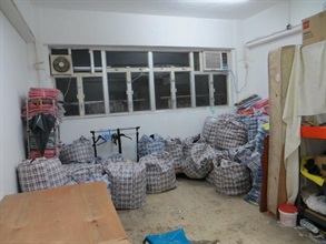 Suspected counterfeit goods seized by the Customs in the storehouse.