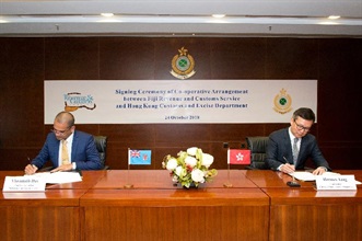 The Commissioner of Customs and Excise, Mr Hermes Tang (right), and the Chief Executive Officer of the Fiji Revenue and Customs Service, Mr Visvanath Das (left), sign the Customs Co-operative Arrangement at the Customs Headquarters Building in Hong Kong today (October 24), with an aim of stepping up mutual co-operation in law enforcement and trade facilitation.