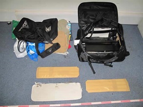 The two packs of heroin allegedly found in the suitcase of the arrested man.