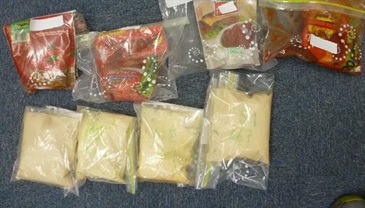 Suspected liquid cocaine found from four packets of tomato sauce inside the suitcase.