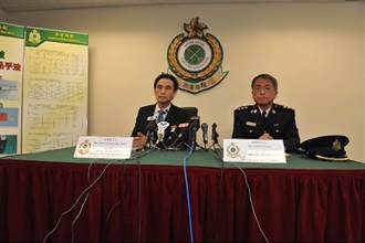 The Head of Customs Drug Investigation Bureau, Mr John Lee (left) today (April 8) speaks about Hong Kong Customs' stepped-up action against drug trafficking at control points during the Easter holidays. Also pictured is the Divisional Commander (Customs Detector Dog), Mr Lam Sze-hau.