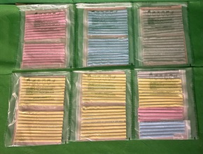 Hong Kong Customs detected four cases of cross-boundary drug trafficking through express parcels at Lok Ma Chau Control Point and Hong Kong International Airport on consecutive days between June 14 and yesterday (June 16). About 23 000 tablets of suspected ecstasy with an estimated market value of about $1.4 million were seized. Photo shows the suspected ecstasy seized in the fourth case.