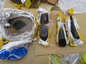 The suspected rhino horn slabs wrapped in aluminium foil and plastic sheets.