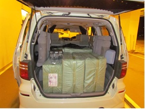 The cross-boundary private car used to smuggle suspected illicit cigarettes.